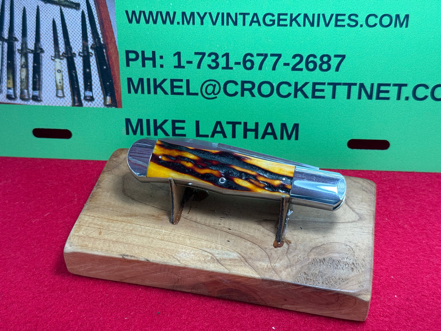 STEIGERWALT, KEN CUSTOM 2010 SEASHELL STAMP SLIP JOINT MANUAL ACTION CUSTOM KNIFE WORMED GROVED AMBER BONE HANDLES