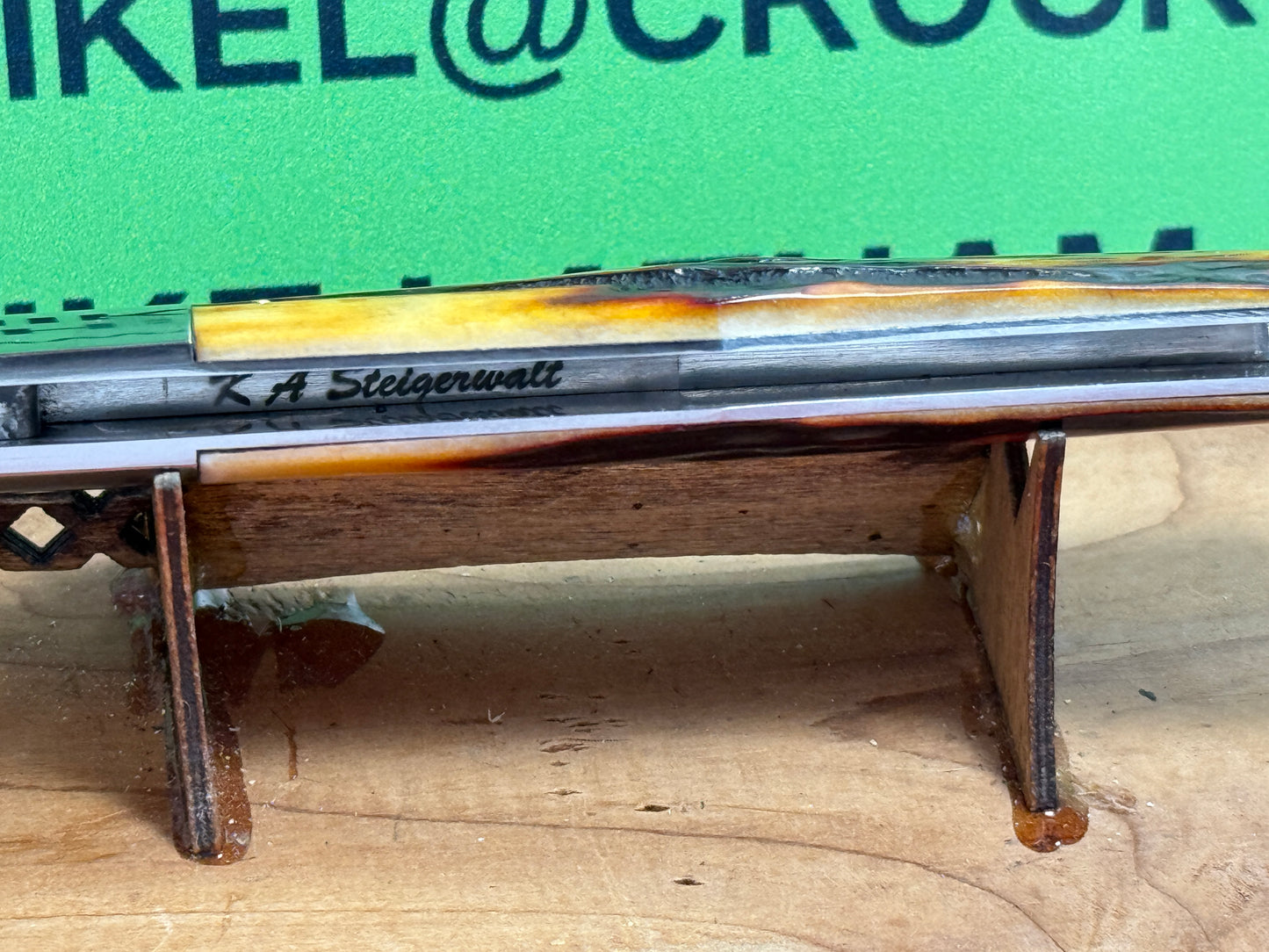 STEIGERWALT, KEN CUSTOM 2010 SEASHELL STAMP SLIP JOINT MANUAL ACTION CUSTOM KNIFE WORMED GROVED AMBER BONE HANDLES