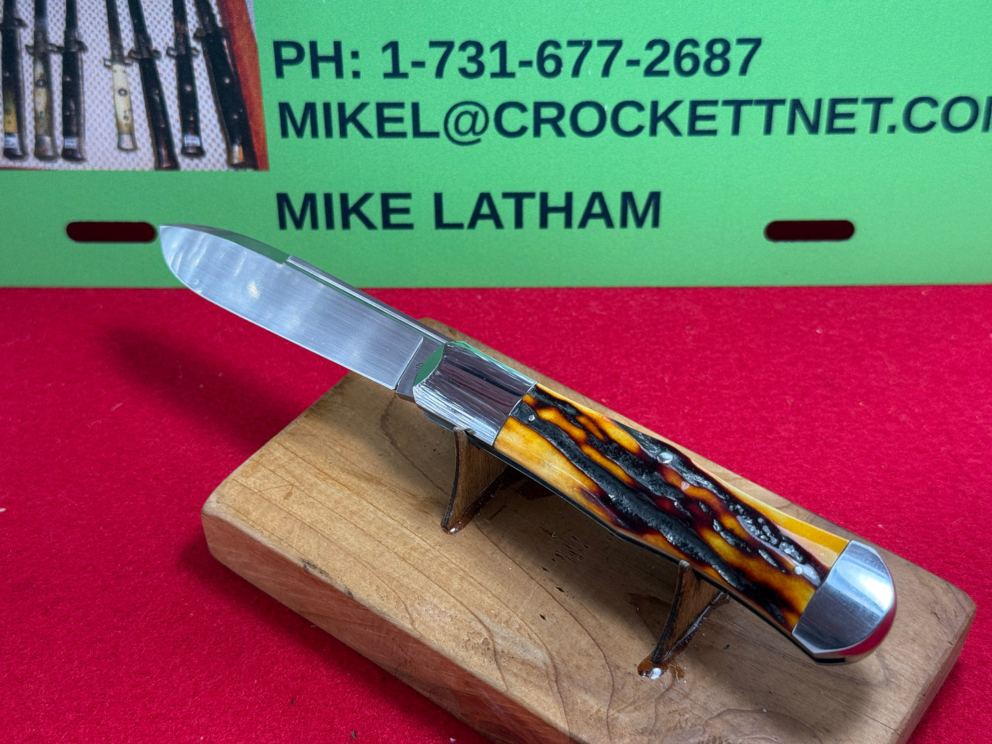 STEIGERWALT, KEN CUSTOM 2010 SEASHELL STAMP SLIP JOINT MANUAL ACTION CUSTOM KNIFE WORMED GROVED AMBER BONE HANDLES