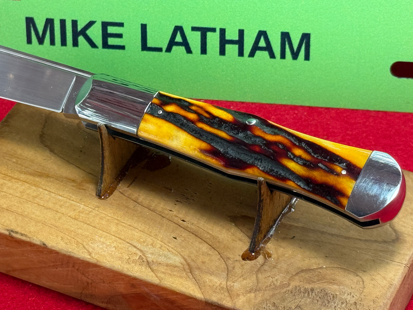 STEIGERWALT, KEN CUSTOM 2010 SEASHELL STAMP SLIP JOINT MANUAL ACTION CUSTOM KNIFE WORMED GROVED AMBER BONE HANDLES