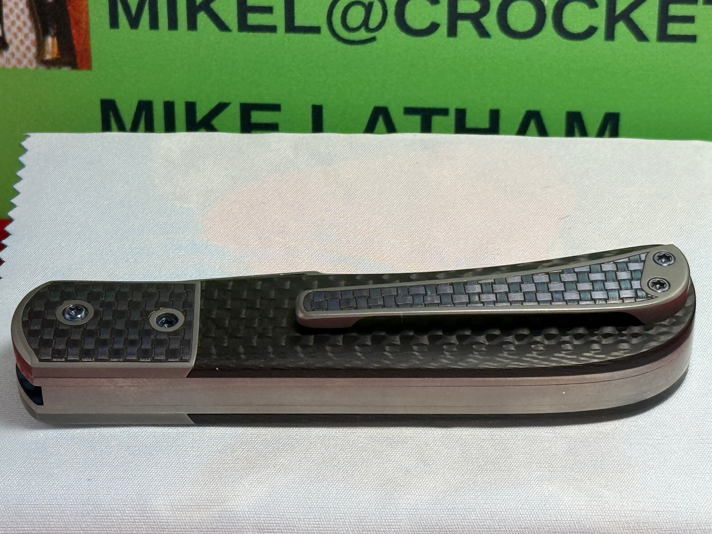 CHEW, LARRY CUSTOM 2023 D/A TRAPPER SHIELD RELEASE CUSTOM ARTWORK BY WILFRED "CHIP" VALTAKIS CUSTOM AUTOMATIC KNIFE CARBON FIBER HANDLES