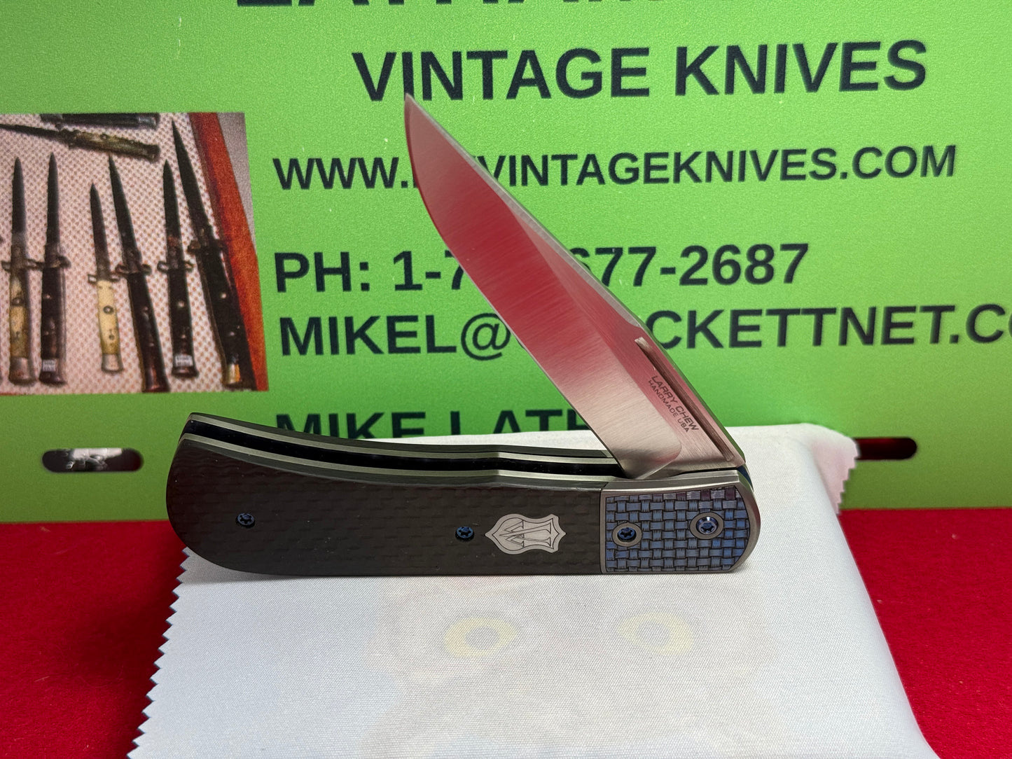 CHEW, LARRY CUSTOM 2023 D/A TRAPPER SHIELD RELEASE CUSTOM ARTWORK BY WILFRED "CHIP" VALTAKIS CUSTOM AUTOMATIC KNIFE CARBON FIBER HANDLES