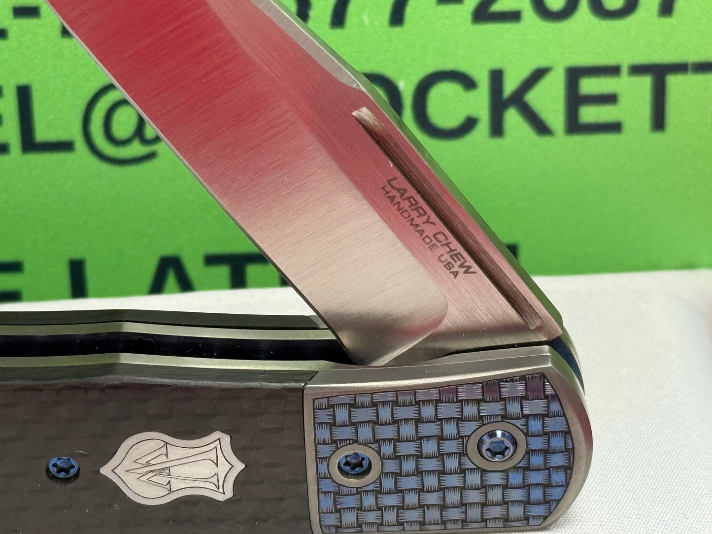 CHEW, LARRY CUSTOM 2023 D/A TRAPPER SHIELD RELEASE CUSTOM ARTWORK BY WILFRED "CHIP" VALTAKIS CUSTOM AUTOMATIC KNIFE CARBON FIBER HANDLES