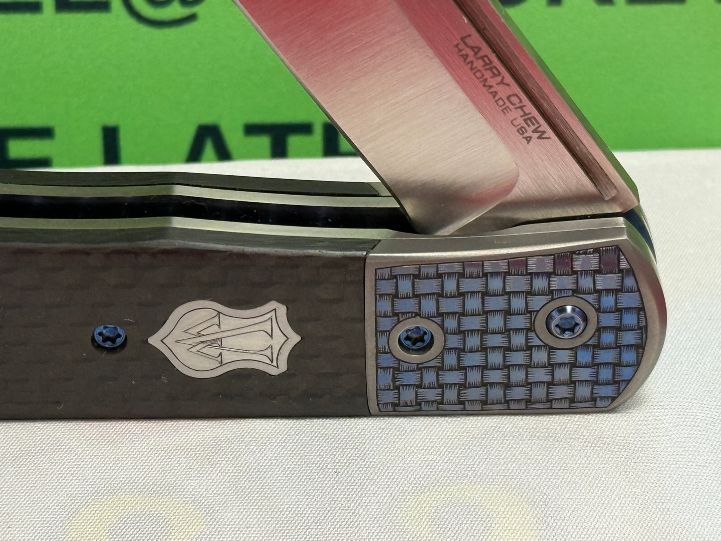 CHEW, LARRY CUSTOM 2023 D/A TRAPPER SHIELD RELEASE CUSTOM ARTWORK BY WILFRED "CHIP" VALTAKIS CUSTOM AUTOMATIC KNIFE CARBON FIBER HANDLES