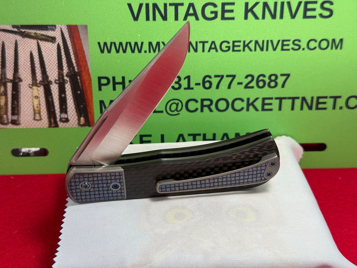 CHEW, LARRY CUSTOM 2023 D/A TRAPPER SHIELD RELEASE CUSTOM ARTWORK BY WILFRED "CHIP" VALTAKIS CUSTOM AUTOMATIC KNIFE CARBON FIBER HANDLES