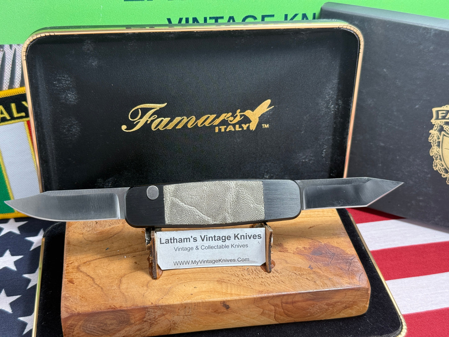 FAMARS ITALY 2012 TWIN BLADE DOUBLE BUTTON PICCOLO AAO759 ITALIAN AUTOMATIC KNIFE BLACK ALUMINUM WITH ELEPHANT IN LAY HANDLES