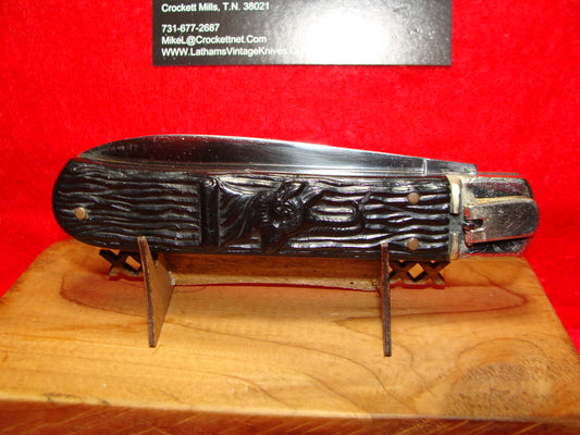 IHER INOX SPAIN 1950-60 LEVER AUTOMATIC SPAIN AUTOMATIC KNIFE BLACK PLASTIC RAISED RAMS HEAD HANDLES