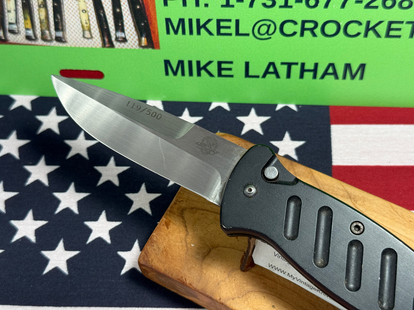 WOODARD, BUCK USA CUSTOM AUTOMATIC 2002-2008 COMBAT AUTO #119 OF 500 TACTICAL AUTOMATIC KNIFE BLACK METAL HANDLES
