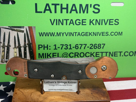 DALTON, ROB CUSTOM AUTOMATIC KNIFE 1998-2010 SIDE OPENING COPPER COMCAT DAMACUS STEEL TACTICAL AUTOMATIC KNIFE COPPER WITH BLACK FIBER HANDLES