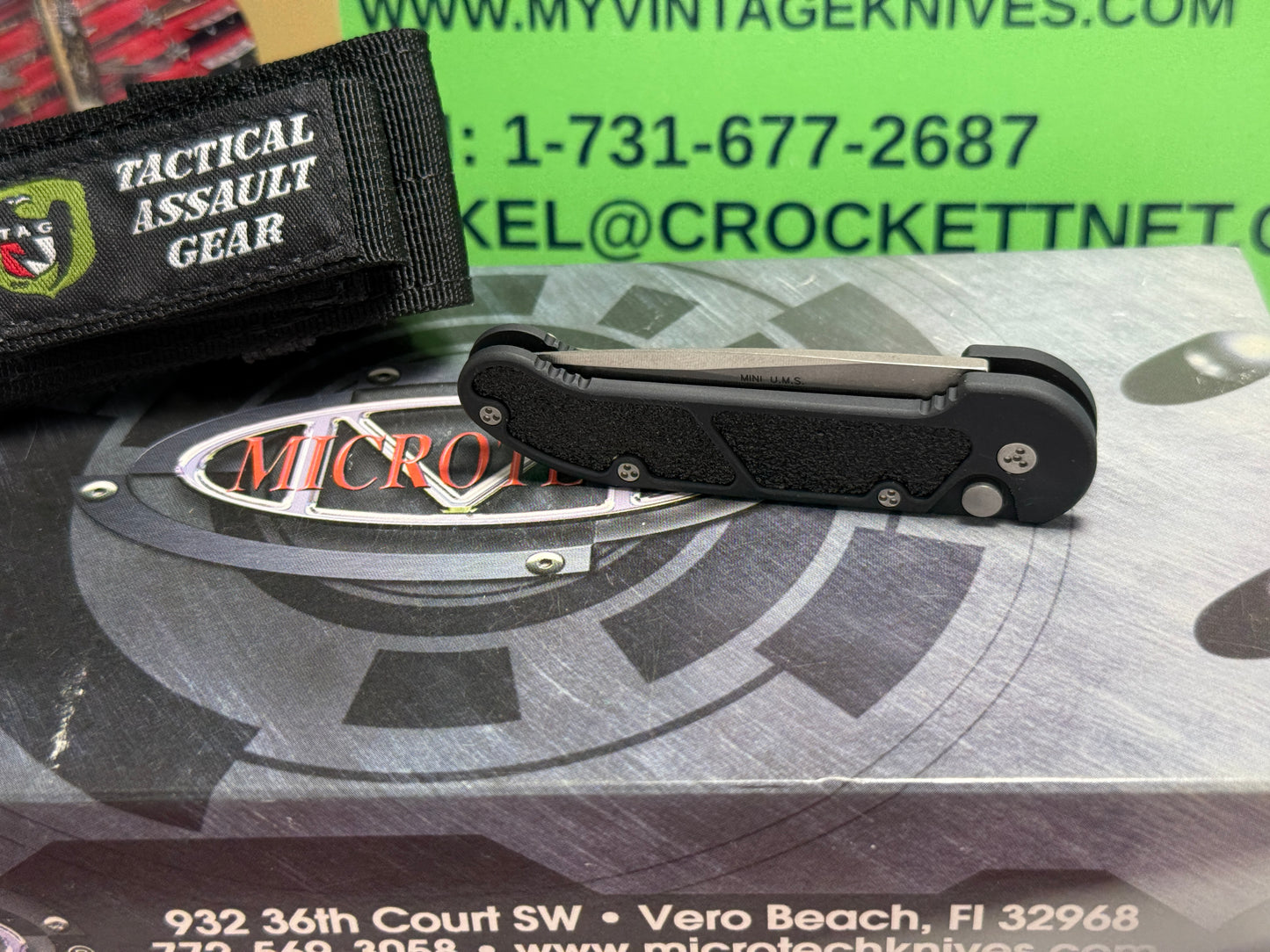 MICROTECH USA 03/2005 TACTICAL MINI U.M.S. STONEWASH PLAIN S/N 1256 TACTICAL AUTOMATIC KNIFE BLACK METAL HANDLES