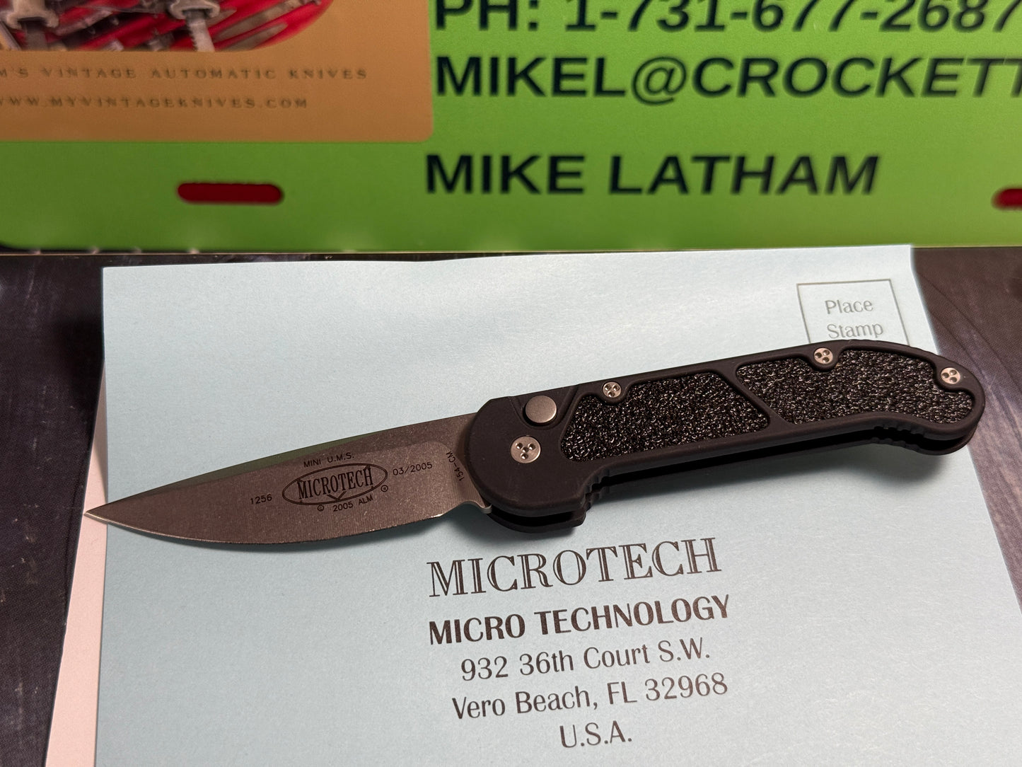 MICROTECH USA 03/2005 TACTICAL MINI U.M.S. STONEWASH PLAIN S/N 1256 TACTICAL AUTOMATIC KNIFE BLACK METAL HANDLES