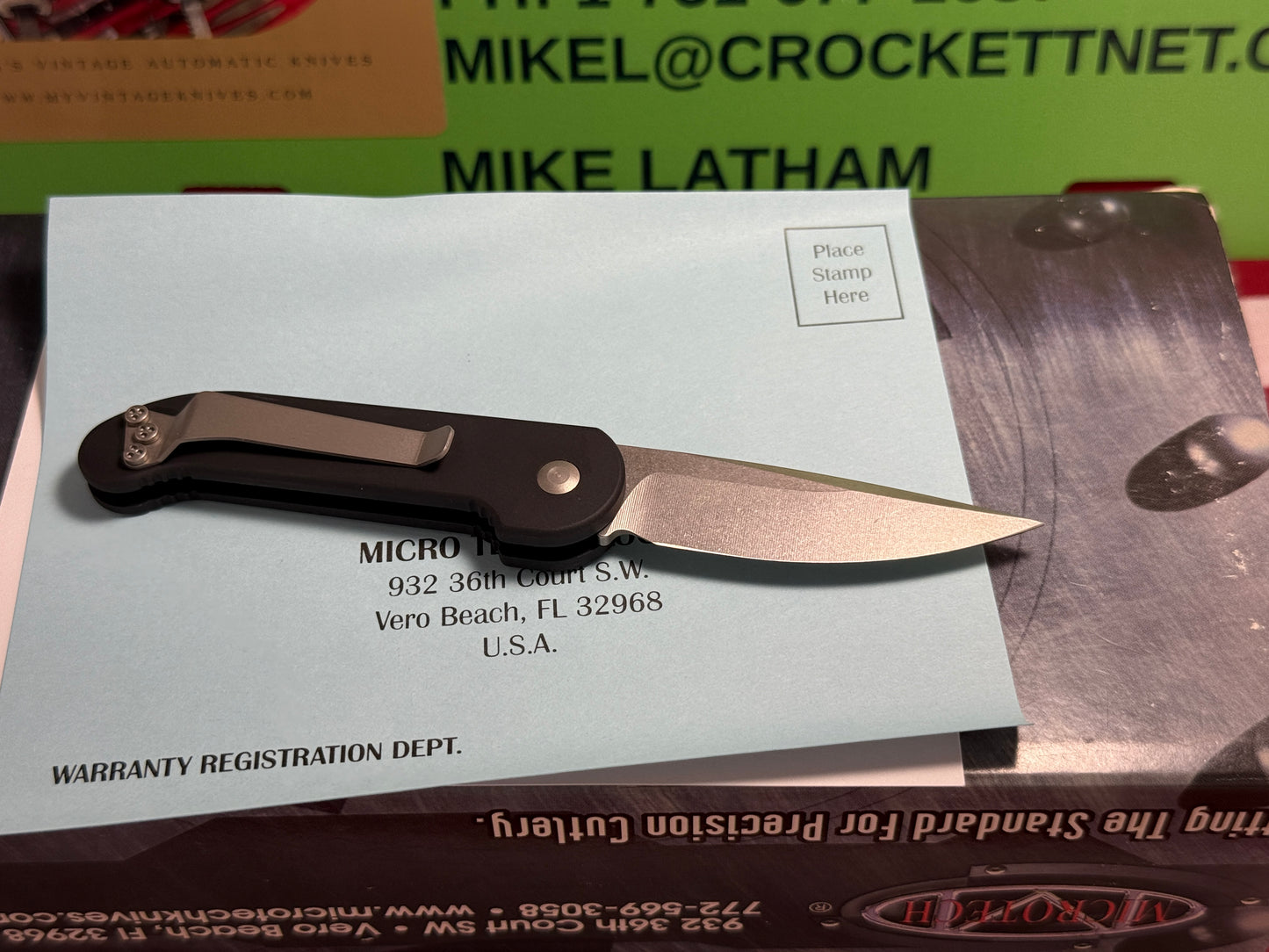 MICROTECH USA 03/2005 TACTICAL MINI U.M.S. STONEWASH PLAIN S/N 1256 TACTICAL AUTOMATIC KNIFE BLACK METAL HANDLES
