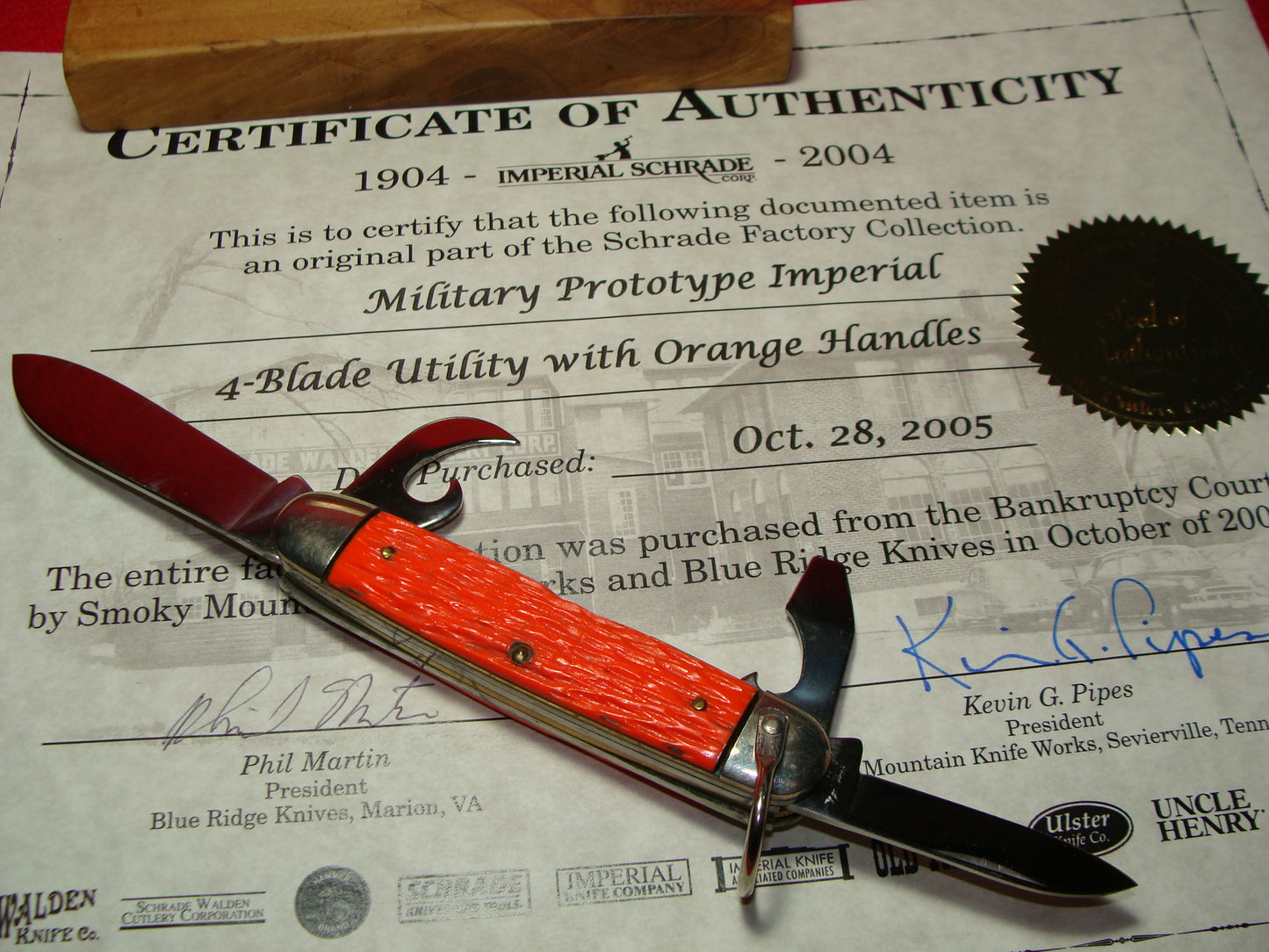 IMPERIAL STAINLESS USA 1960-76 MILITARY PROTOTYPE 4 BLADE UTILITY FOLDING NON AUTOMATIC KNIFE ORANGE DELRIN HANDLES PART OF THE SCHRADE FACTORY COLLECTION